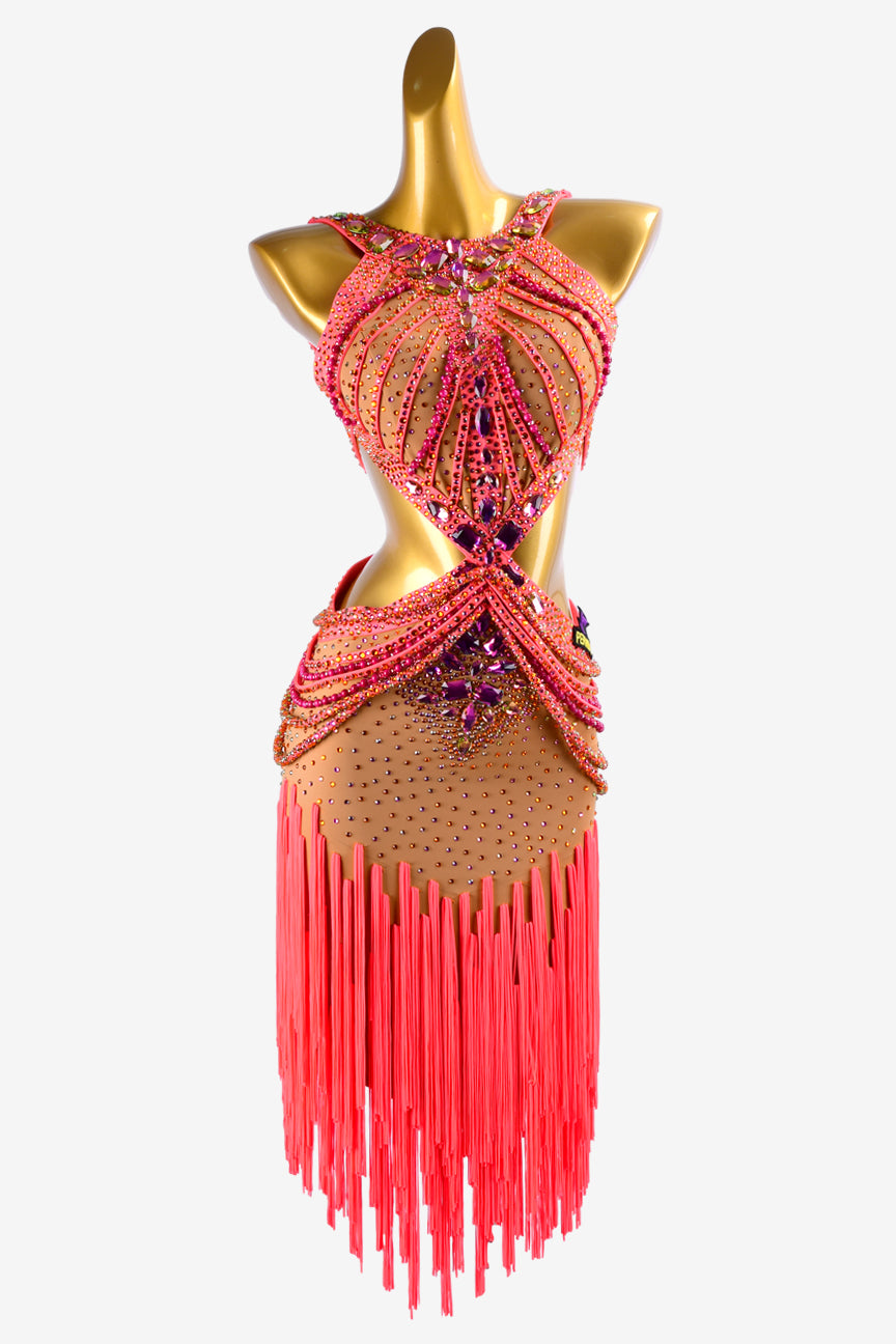 Permino fleshtone lycra Latin dress with oranger red stone string, fringes & rhinestones